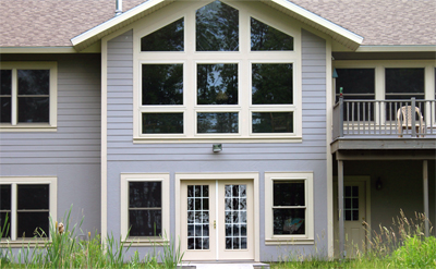 Residential Contruction Services for the Eastern Upper Peninsula: Lakeside Home with Custom Windows and Floor Plan